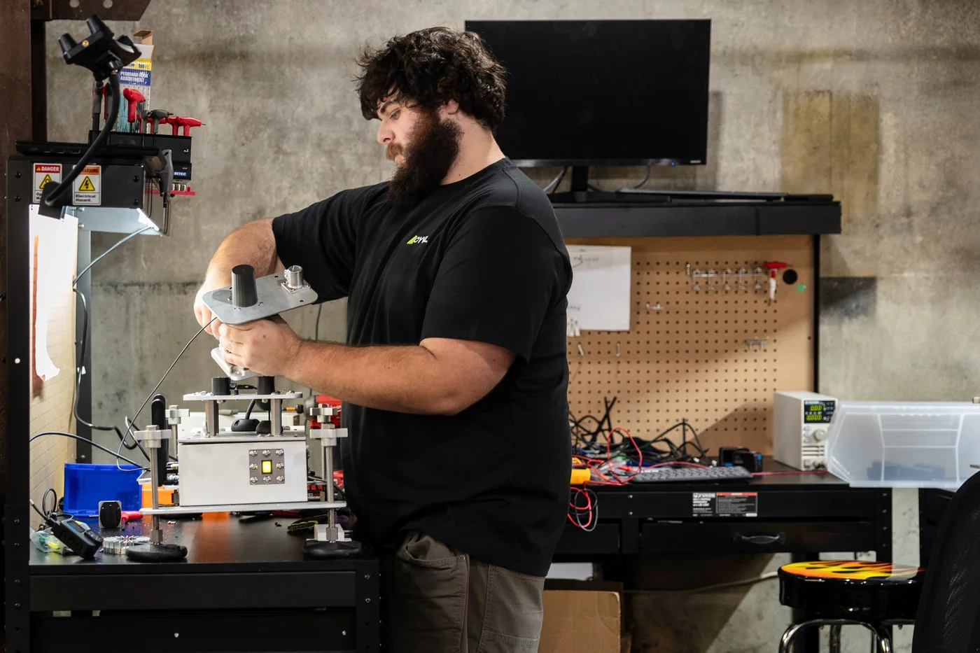 A CYVL engineer assembling a V3 sensor rig in the hardware lab